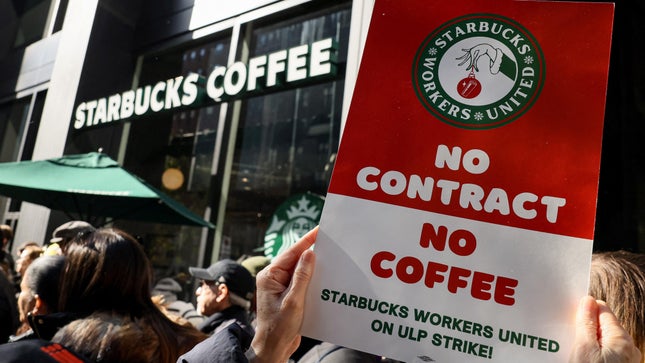 Starbucks Workers United members strike outside a Starbucks in New York on November 16. 